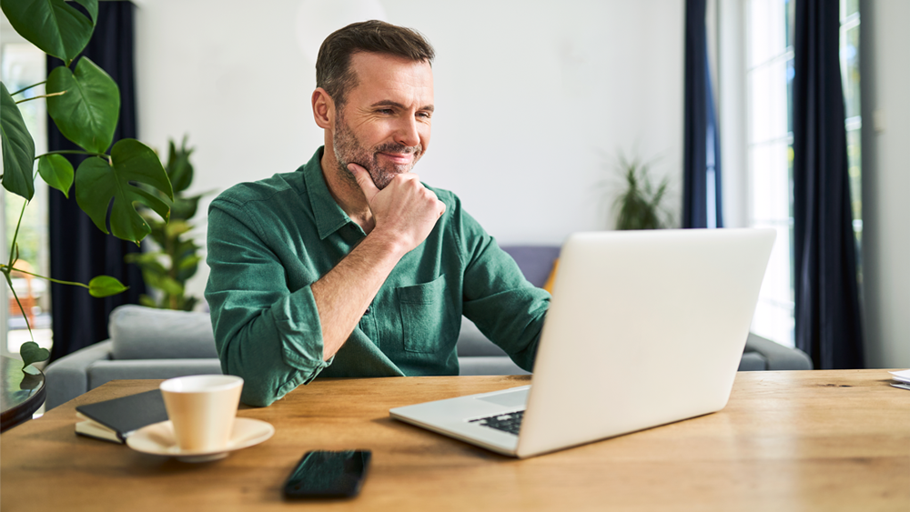 A man looking at laptop