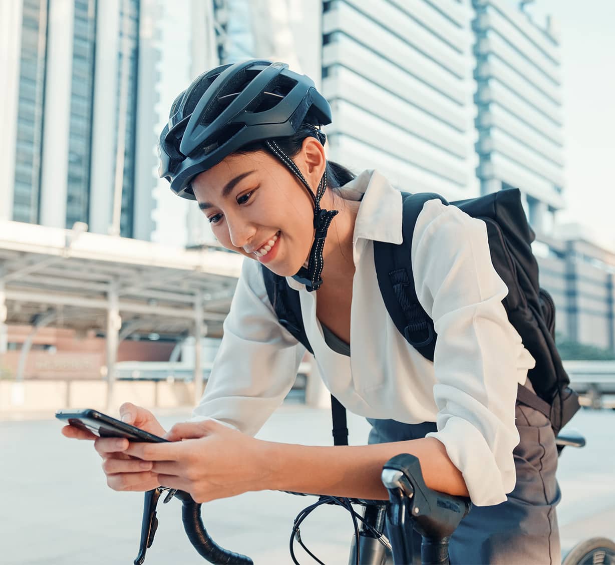 Women looking at mobile with card