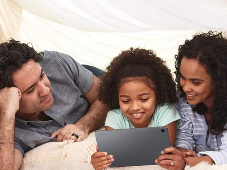 Family watching tablet