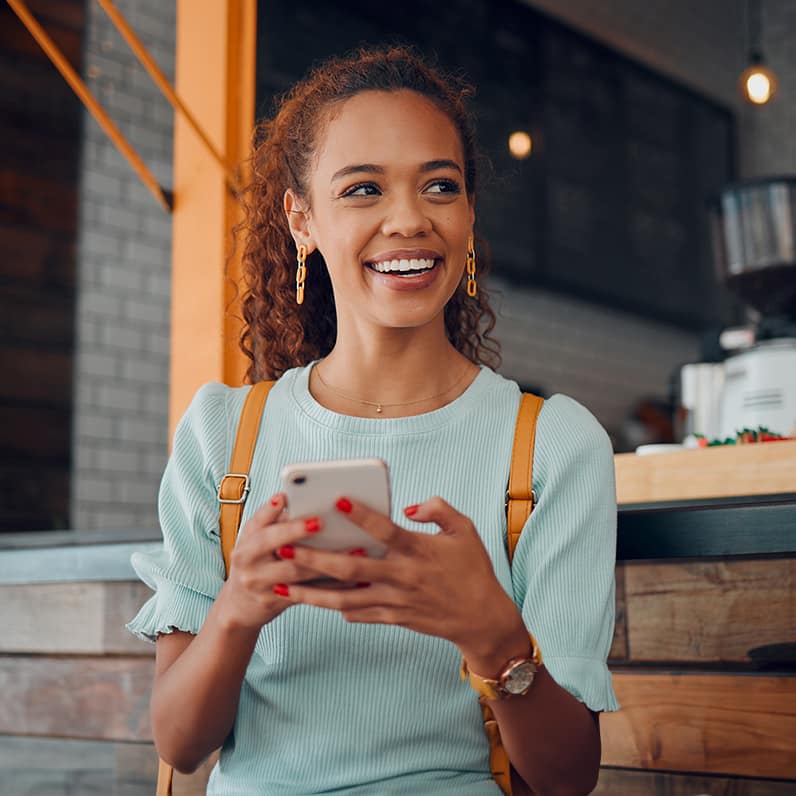 a woman holding the phone with smile