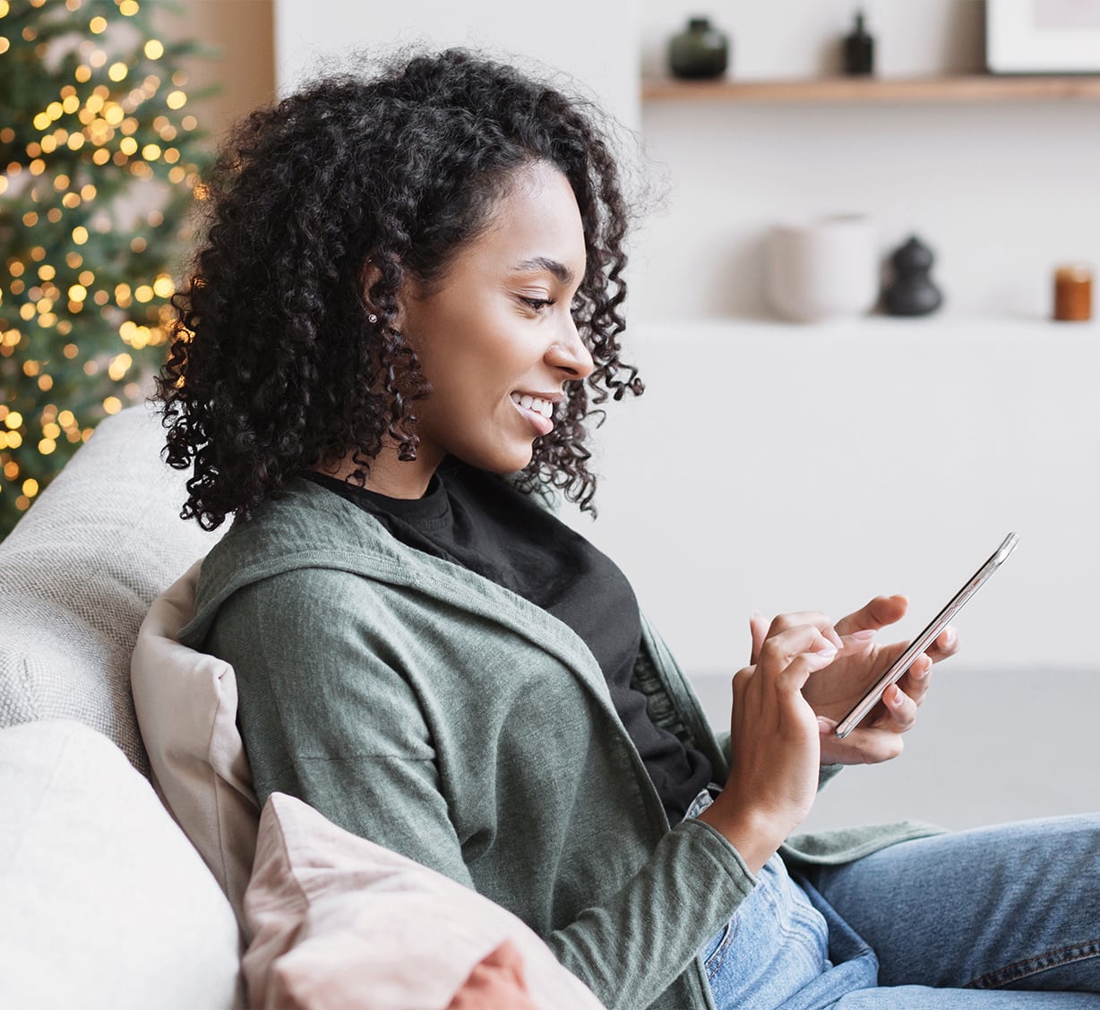 QR code to download app and woman looking at her mobile
